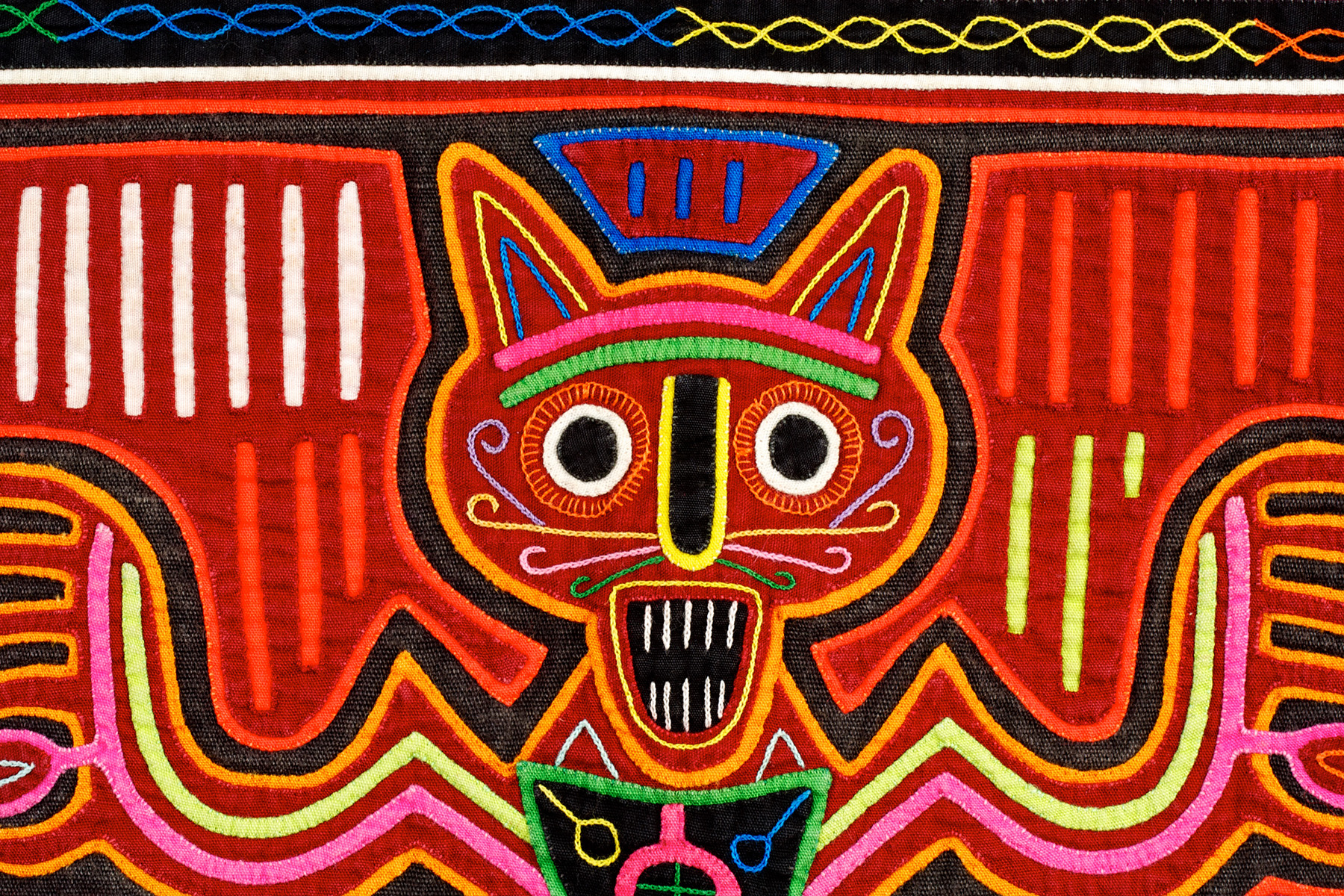 Detail of mola with cat on TV